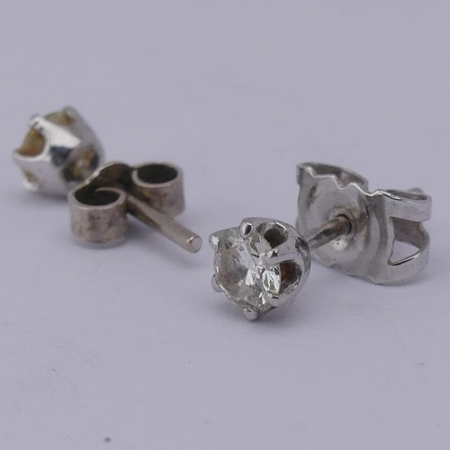 326 - A pair of single stone diamond Earrings, the brilliant cut stones each approx. 0.19ct, claw set in u... 