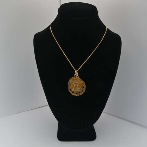 375 - An 18ct yellow gold 'Gemini' Zodiac Pendant, together with an 18ct gold pendant initialled 'L' and a... 