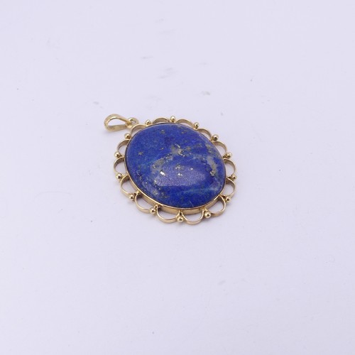 266 - An 18ct yellow gold mounted lapis lazuli Pendant, 4cm long exc. bale, 10.4g.