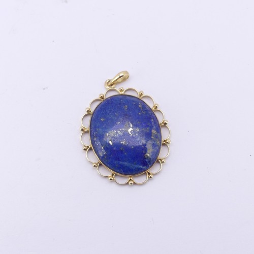 266 - An 18ct yellow gold mounted lapis lazuli Pendant, 4cm long exc. bale, 10.4g.