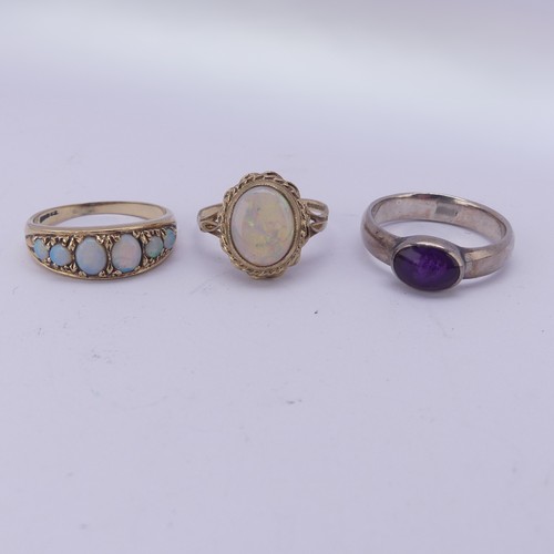 177 - A graduated six stone opal Ring, mounted in 9ct yellow gold, Size N½, together with an opal cabochon... 