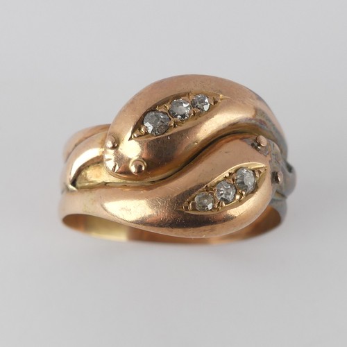 178 - An antique 9ct rose gold double snake Ring, the snake heads each set three graduated old cut diamond... 