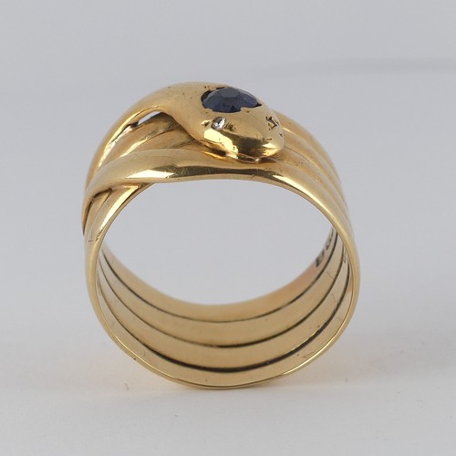 179 - A late Victorian 18ct yellow gold coiled snake Ring, the head set with a facetted sapphire, approx. ... 