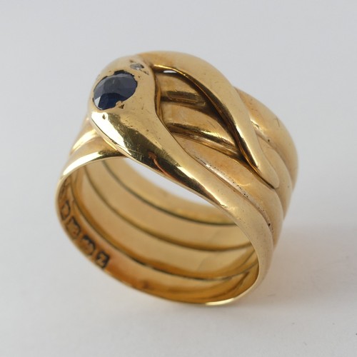 179 - A late Victorian 18ct yellow gold coiled snake Ring, the head set with a facetted sapphire, approx. ... 