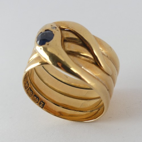 179 - A late Victorian 18ct yellow gold coiled snake Ring, the head set with a facetted sapphire, approx. ... 