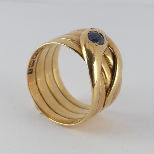 179 - A late Victorian 18ct yellow gold coiled snake Ring, the head set with a facetted sapphire, approx. ... 