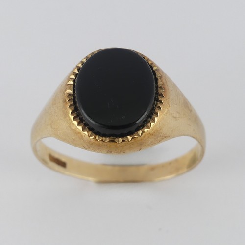 180 - A 9ct yellow gold Signet Ring, the front set oval black onxy, Size V, 3.5g.