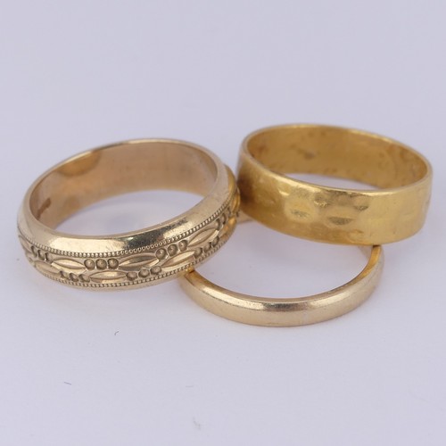 183 - A 22ct yellow gold textured Band, 5.9mm wide, Size Q½, 5.6g, together with a narrow 9ct gold ... 