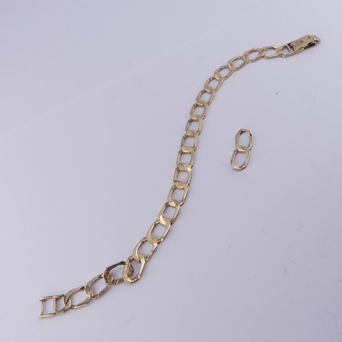 299 - A 9ct yellow gold curb link Bracelet, 19cm long with two further spare links removed, approx. total ... 