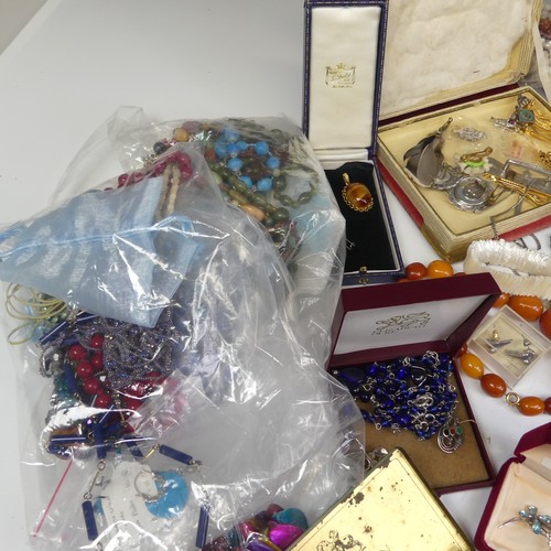 386 - A quantity of Costume Jewellery, including a string of faux butterscotch amber beads, other bead nec... 