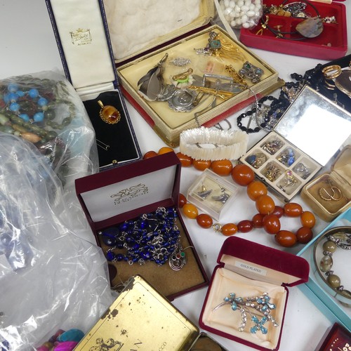 386 - A quantity of Costume Jewellery, including a string of faux butterscotch amber beads, other bead nec... 