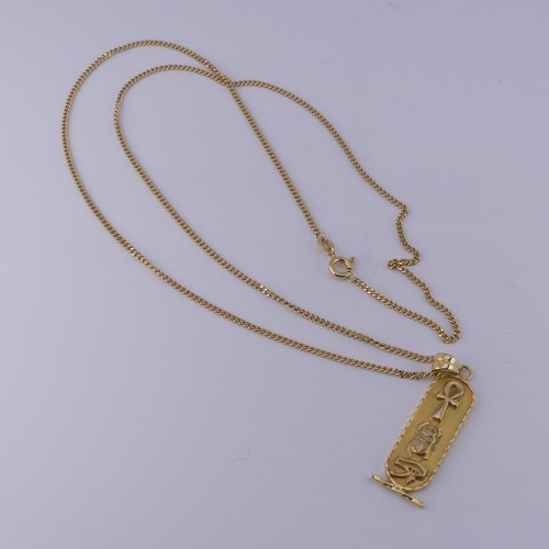 271 - An 18ct yellow gold Egyptian Pendant, of typical design with hieroglyphs front and reverse, 4.2cm lo... 