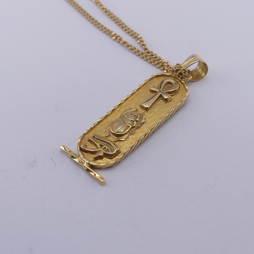 271 - An 18ct yellow gold Egyptian Pendant, of typical design with hieroglyphs front and reverse, 4.2cm lo... 