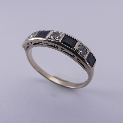 191 - A sapphire and diamond half hoop Eternity Ring, channel set with four calibre cut sapphires and thre... 