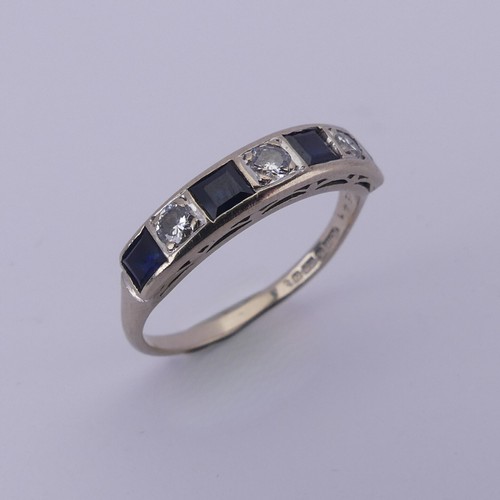 191 - A sapphire and diamond half hoop Eternity Ring, channel set with four calibre cut sapphires and thre... 