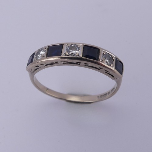 191 - A sapphire and diamond half hoop Eternity Ring, channel set with four calibre cut sapphires and thre... 