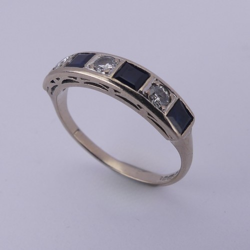 191 - A sapphire and diamond half hoop Eternity Ring, channel set with four calibre cut sapphires and thre... 