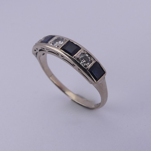 191 - A sapphire and diamond half hoop Eternity Ring, channel set with four calibre cut sapphires and thre... 