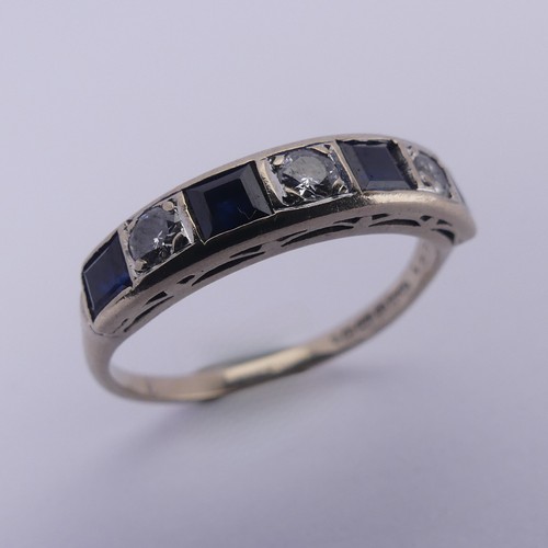 191 - A sapphire and diamond half hoop Eternity Ring, channel set with four calibre cut sapphires and thre... 