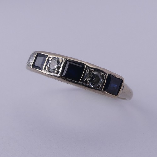 191 - A sapphire and diamond half hoop Eternity Ring, channel set with four calibre cut sapphires and thre... 