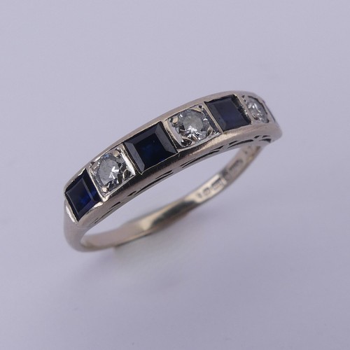 191 - A sapphire and diamond half hoop Eternity Ring, channel set with four calibre cut sapphires and thre... 