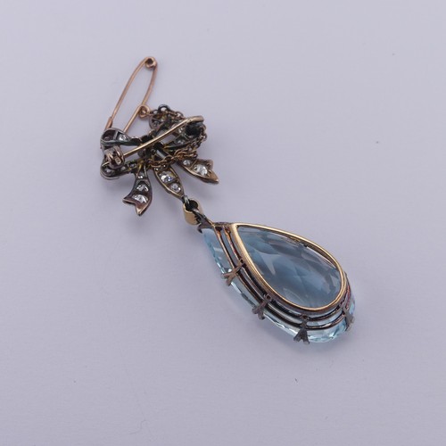 273 - An Edwardian Belle Epoque aquamarine and diamond Brooch, the pear shaped facetted aquamarine, approx... 