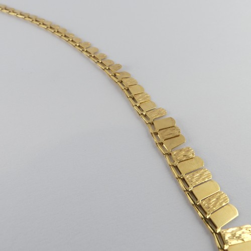 274 - A 9ct yellow gold 'Cleopatra' style fringe Necklace, 42cm long, 6.8g.