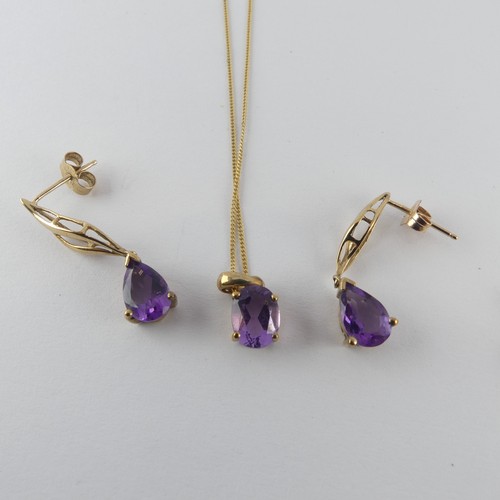 394 - A 9ct yellow gold mounted amethyst Pendant, the stone 8.2mm long, on 9ct gold trace chain,together w... 