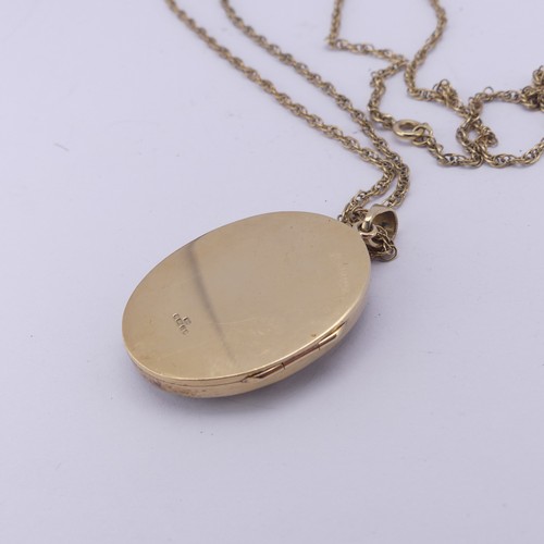 275 - A 9ct yellow gold oval hinged Locket Pendant, with lattice pierced front, 3.5cm long exc. bale, on a... 