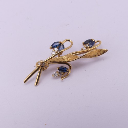 335 - An 18ct yellow gold foliate spray Brooch, the three flower heads set sapphires and diamonds, 4cm lon... 