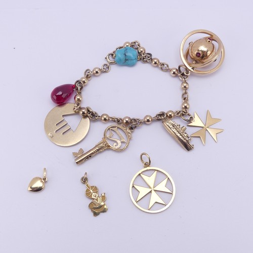 305 - A 9ct yellow gold Charm Bracelet, suspended with a turquoise matrix, a pear shaped ruby glass charm,... 