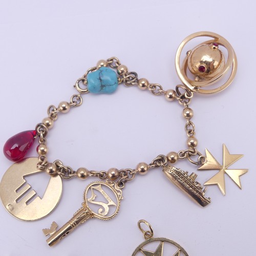 305 - A 9ct yellow gold Charm Bracelet, suspended with a turquoise matrix, a pear shaped ruby glass charm,... 