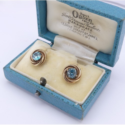 337 - A pair of blue topaz Earrings, the circular facetted stones approx. 5.8mm diameter four claw set in ... 