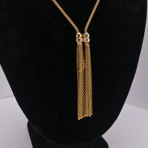 277 - A 9ct yellow gold tassle Necklace, the snake link chain terminating at the front with a double tassl... 