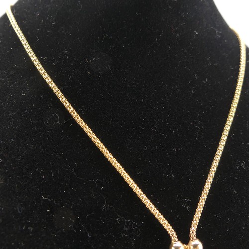 277 - A 9ct yellow gold tassle Necklace, the snake link chain terminating at the front with a double tassl... 