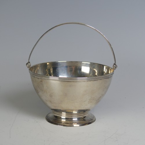 100 - Tiffany & Co.; An Art Deco silver Sugar Basket, of circular form, the swing handle with reeded d... 