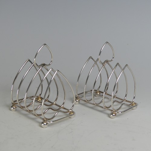 108 - A pair of Edwardian silver five bar Toast Racks, by Charles Horner, hallmarked Birmingham 1905, with... 