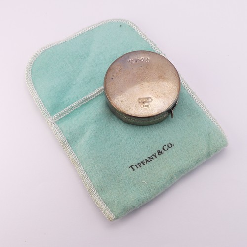 97 - Tiffany & Co.; A circular silver Tape Measure, 2m / 79