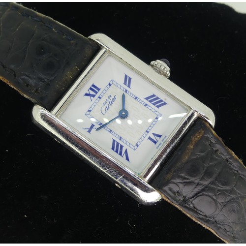 144 - A Must de Cartier silver quartz Tank Wristwatch, model ref: 2416, the white dial with blue Roman num... 