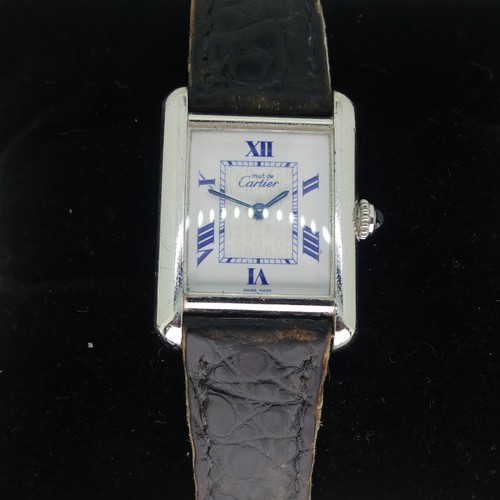 144 - A Must de Cartier silver quartz Tank Wristwatch, model ref: 2416, the white dial with blue Roman num... 