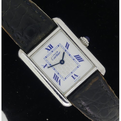 144 - A Must de Cartier silver quartz Tank Wristwatch, model ref: 2416, the white dial with blue Roman num... 