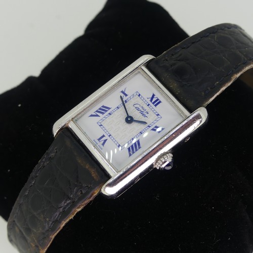 144 - A Must de Cartier silver quartz Tank Wristwatch, model ref: 2416, the white dial with blue Roman num... 