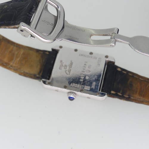 144 - A Must de Cartier silver quartz Tank Wristwatch, model ref: 2416, the white dial with blue Roman num... 