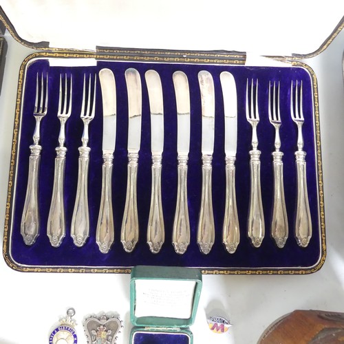 111 - A cased set of six George V silver handled Dessert Knives and Forks, hallmarked Sheffield 1915, toge... 