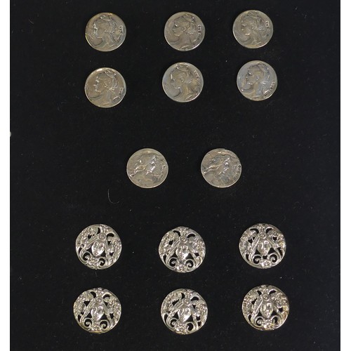 116 - A set of six Edwardian silver Buttons, Birmingham 1901, pierced with a mask and flowers in the Art N... 