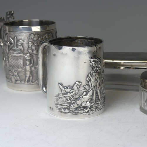 100A - An early 20thC Eastern silver Mug, possibly Chinese / Burmese, the base marked 'T.P. 90', with conti... 