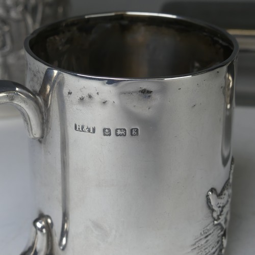 100A - An early 20thC Eastern silver Mug, possibly Chinese / Burmese, the base marked 'T.P. 90', with conti... 