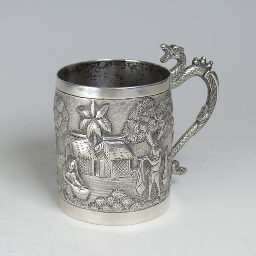 100A - An early 20thC Eastern silver Mug, possibly Chinese / Burmese, the base marked 'T.P. 90', with conti... 