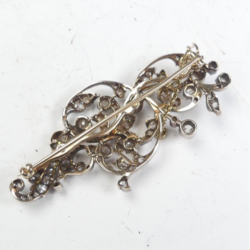 310A - An antique diamond foliate Brooch, formed of old and single cut stones, the largest approx. 0.3ct, t... 