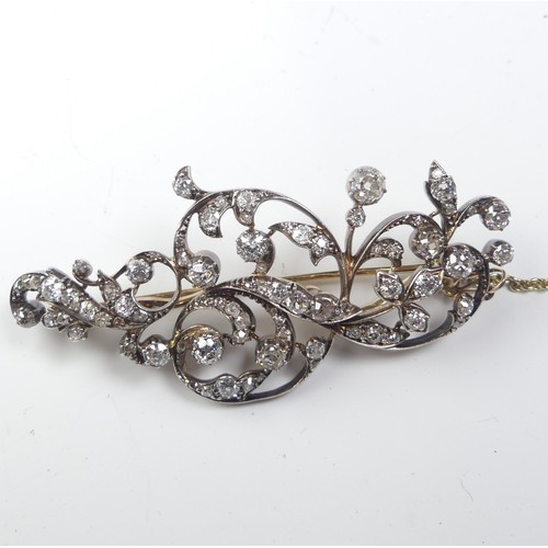 310A - An antique diamond foliate Brooch, formed of old and single cut stones, the largest approx. 0.3ct, t... 